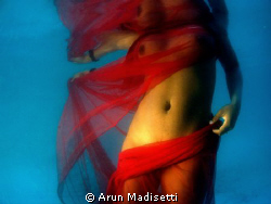 Woman in Red.
Original image, with side lighting from th... by Arun Madisetti 